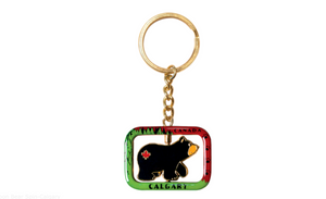 Adorable cartoon bear key chain featuring a Calgary design, perfect for adding a touch of charm to your keys or bags