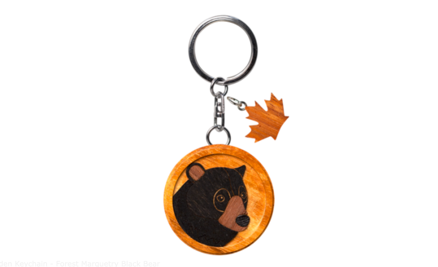 Handcrafted wooden keychain featuring a forest marquetry design with a black bear motif, a stylish and nature-inspired accessory for your keys