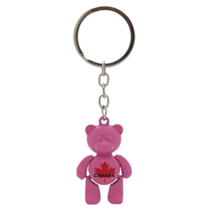 A charming pink bear-shaped souvenir keychain from Canada, perfect for adding a touch of Canadian wilderness to your keys or bag