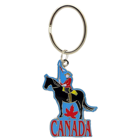 A decorative keychain featuring a detailed figurine of a Canadian RCMP Mountie riding a horse, serving as a unique and patriotic souvenir from Canada